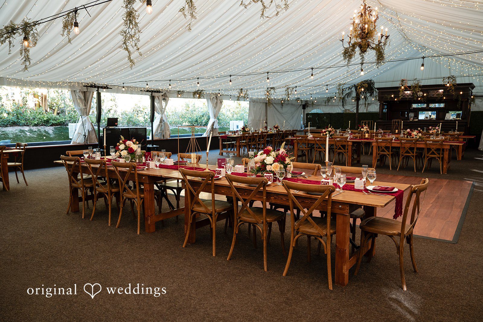Beautifully arranged tables at the wedding reception tent