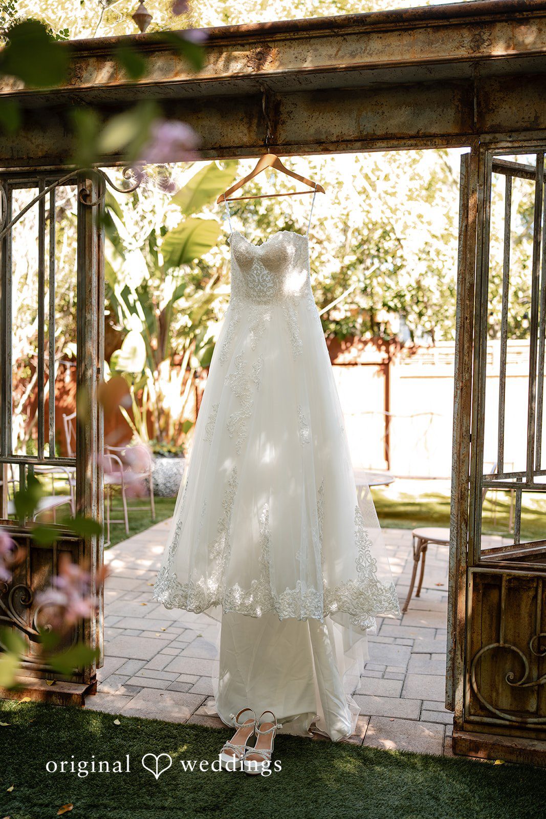 The bride's gown gracefully hanging at Botanica