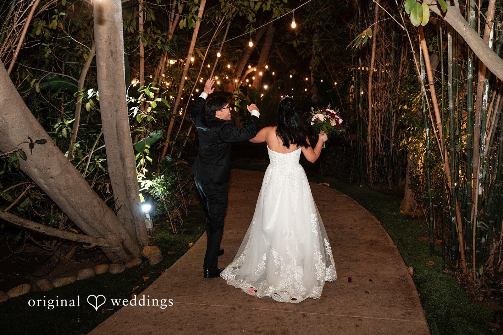 The couple makes a joyful exit at Botanica