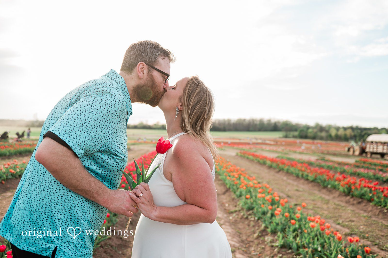 Suzanna + Morgan Sweet moment of Suzanna & Morgan sharing a kiss in the flower fields