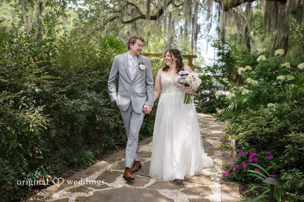 Kaitlyn + Corbin Charleston wedding photography of a couple surrounded by lush greenery, capturing intimate moments in a natural, romantic garden setting.