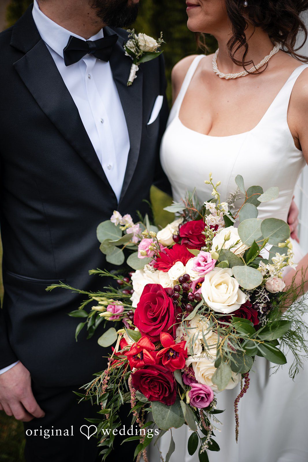 Elizabeth + Aldo Bride and groom portrait with bouquet detail outdoors