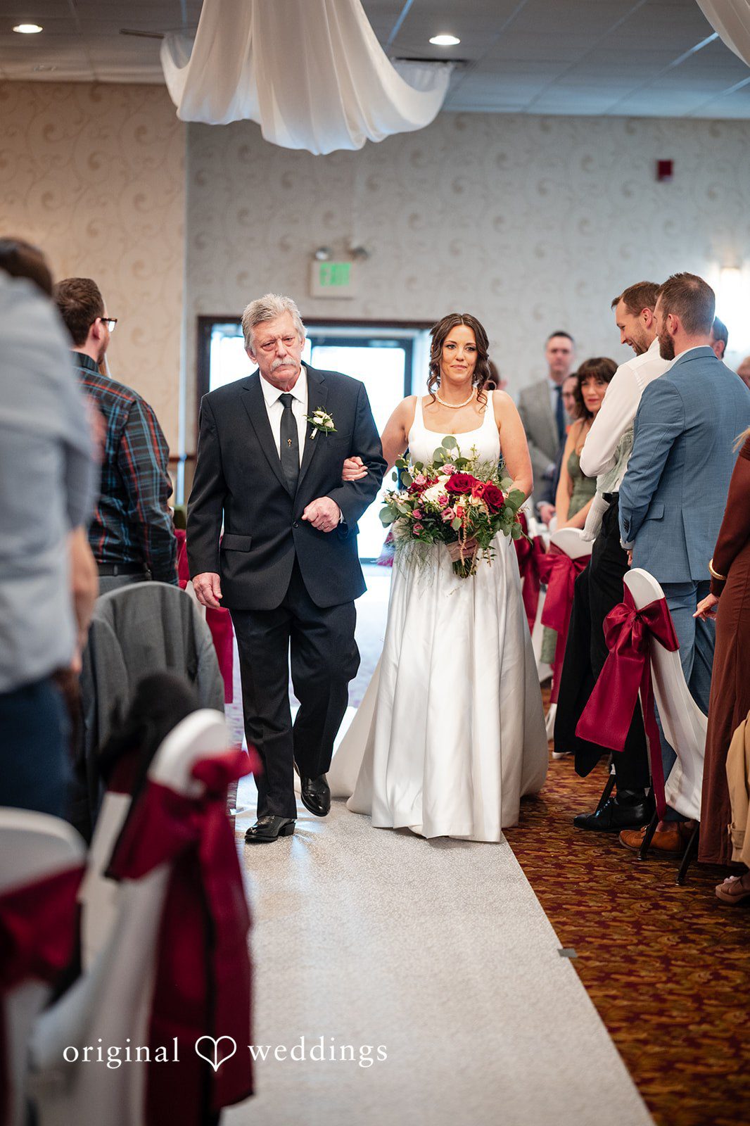 Elizabeth + Aldo Bride walking down the aisle during the indoor ceremony