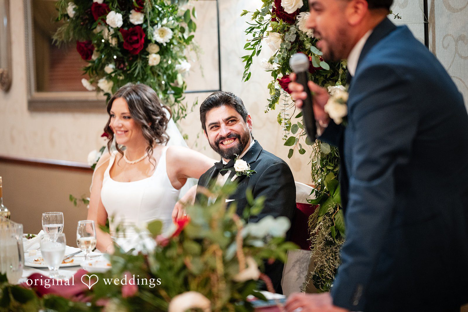 Elizabeth + Aldo Reception speech moment with bride and groom smiling