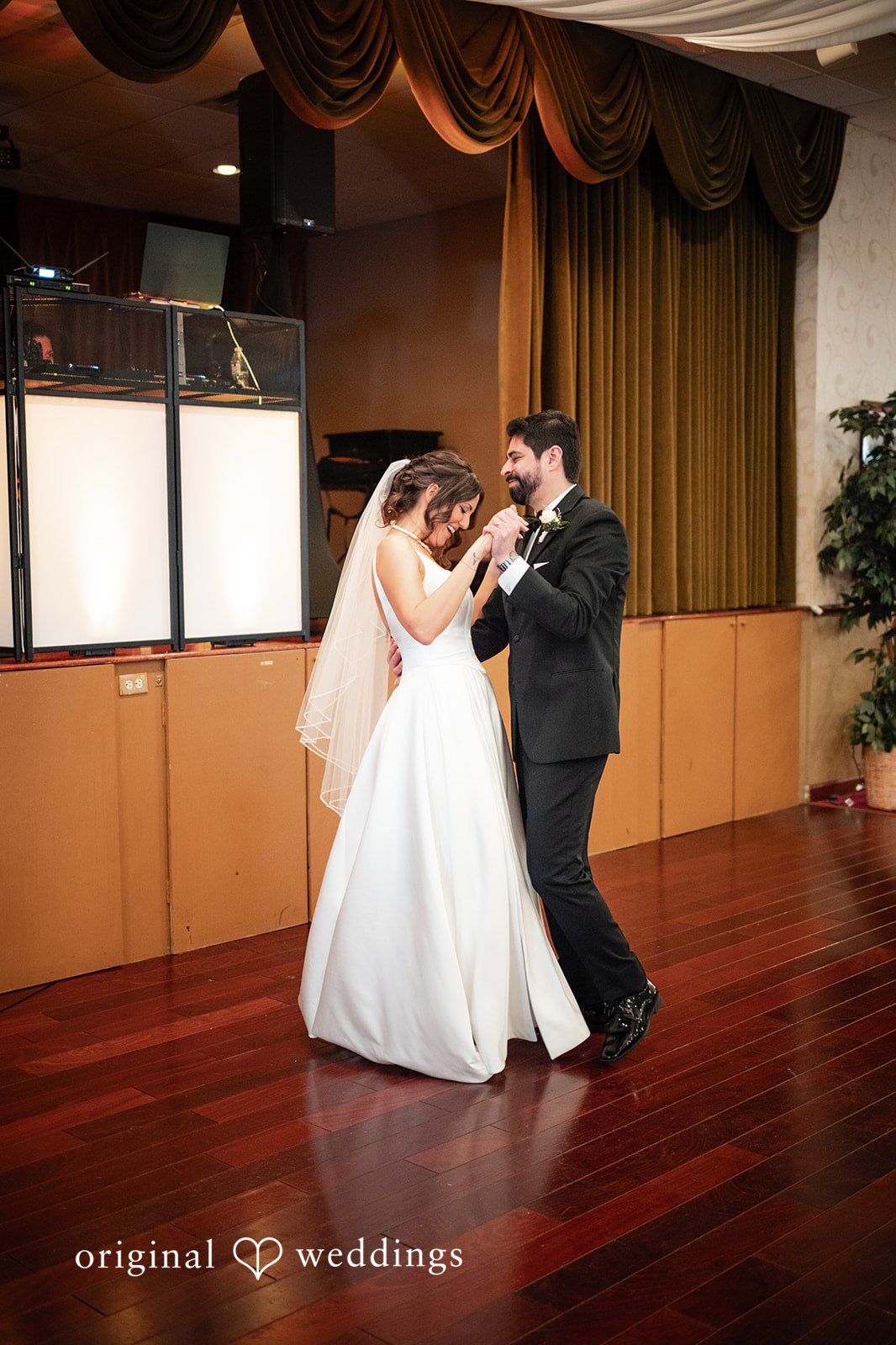Elizabeth + Aldo Bride and groom sharing their first dance at the reception