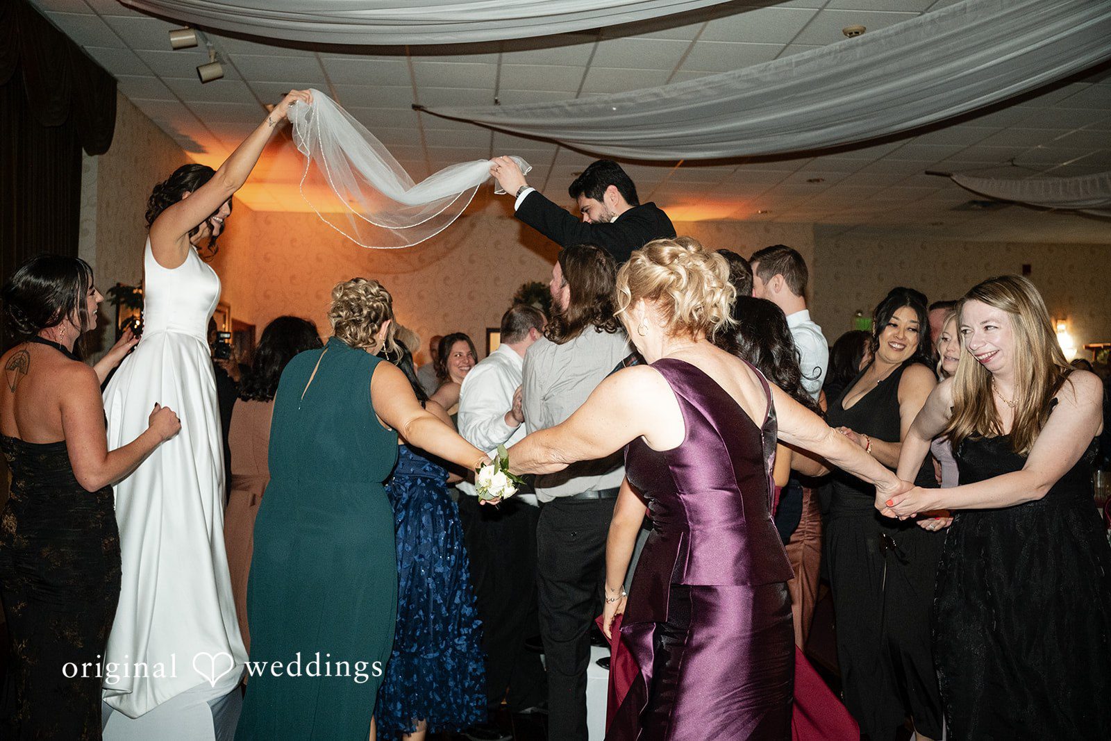 Elizabeth + Aldo Fun dance floor moment during the wedding reception