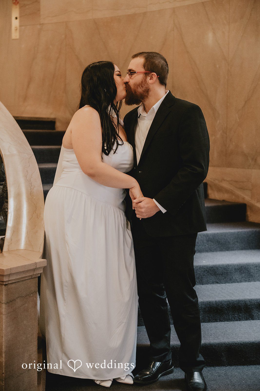 The couple shares a kiss