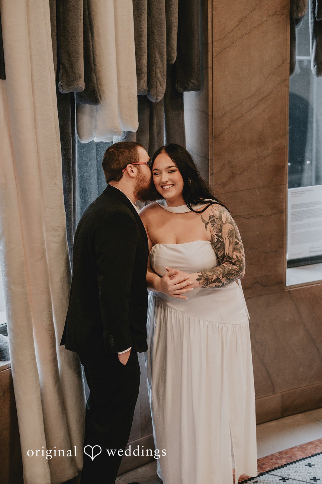 The groom pecks his bride