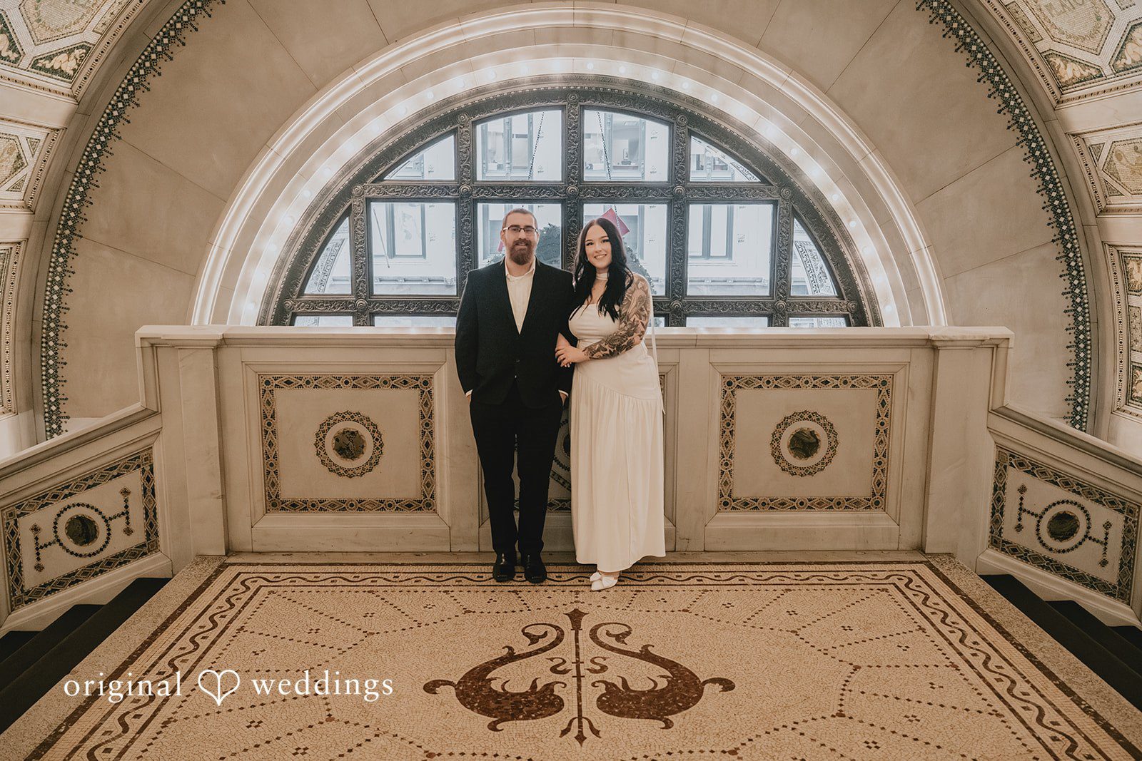 Our Chicago wedding photographers at Original Weddings captured a stunning portrait of the couple at Chicago Cultural Center
