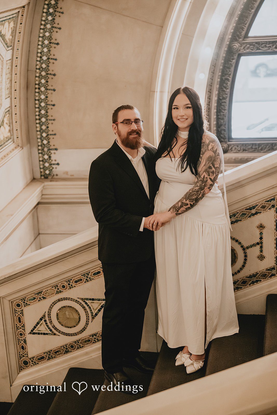 A beautiful portrait of the couple by the stairs