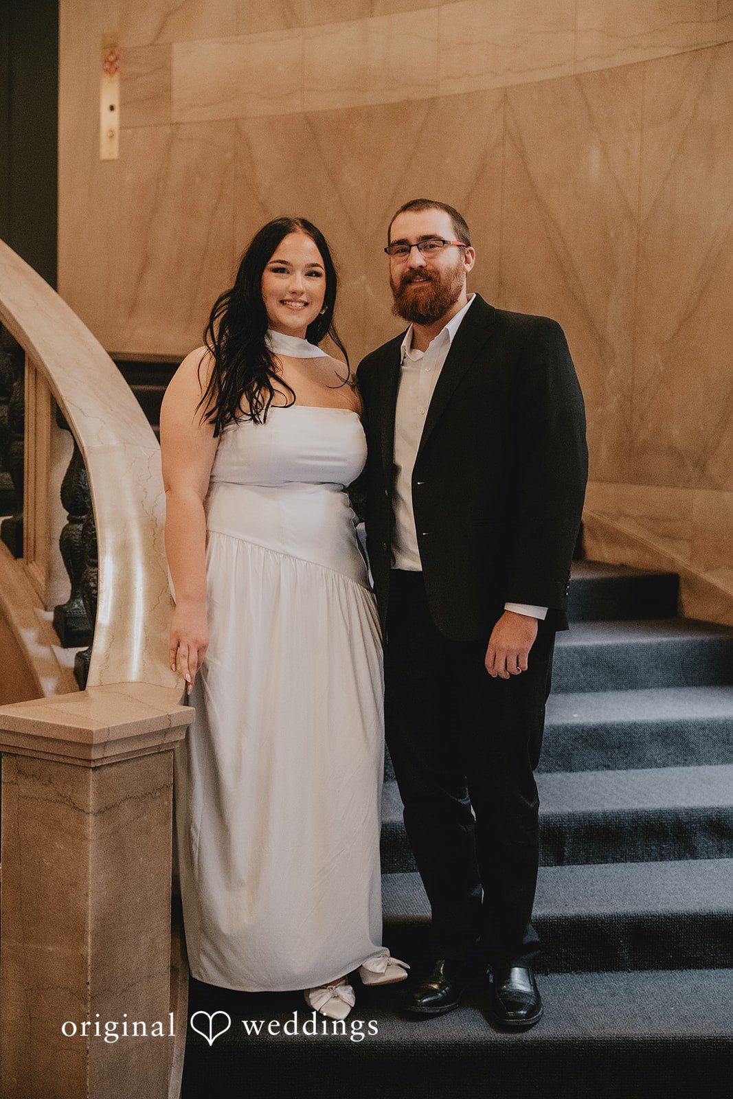 Our Chicago wedding photographers captured a beautiful portrait of the couple by the stairs at Chicago Cultural Center
