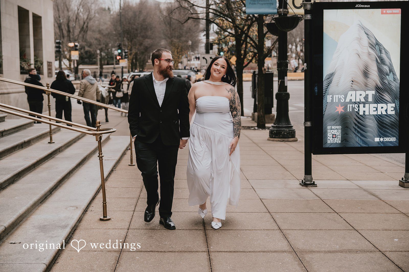 Our Chicago wedding photographers at Original Weddings captured a stunning portrait of the couple taking a walk at Chicago Cultural Center