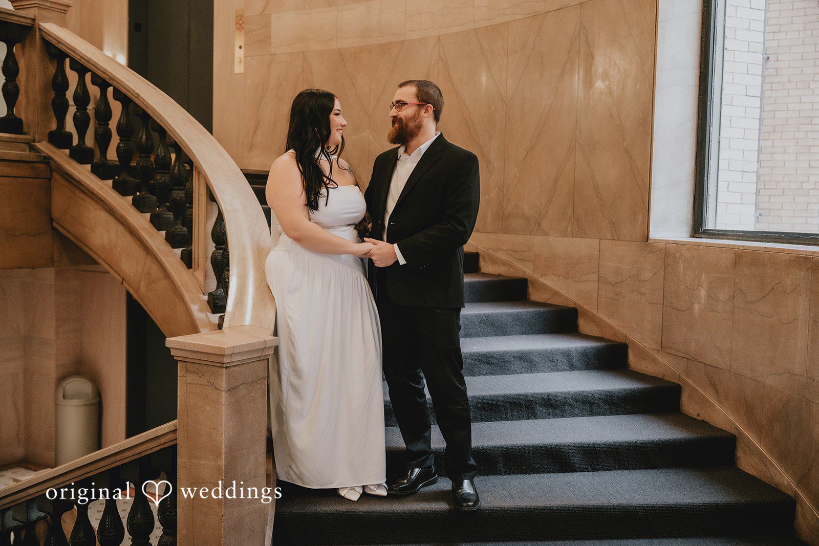A stunning portrait of the couple by the stairs at Chicago Cultural Center