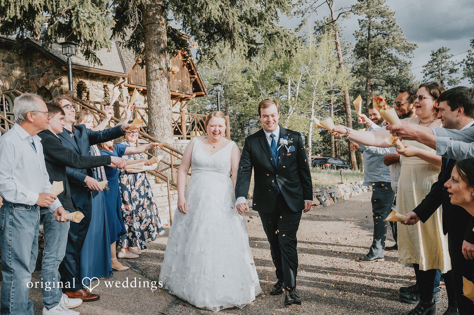 Kelsi + Christian The couple makes a joyful exit with cheers from guests
