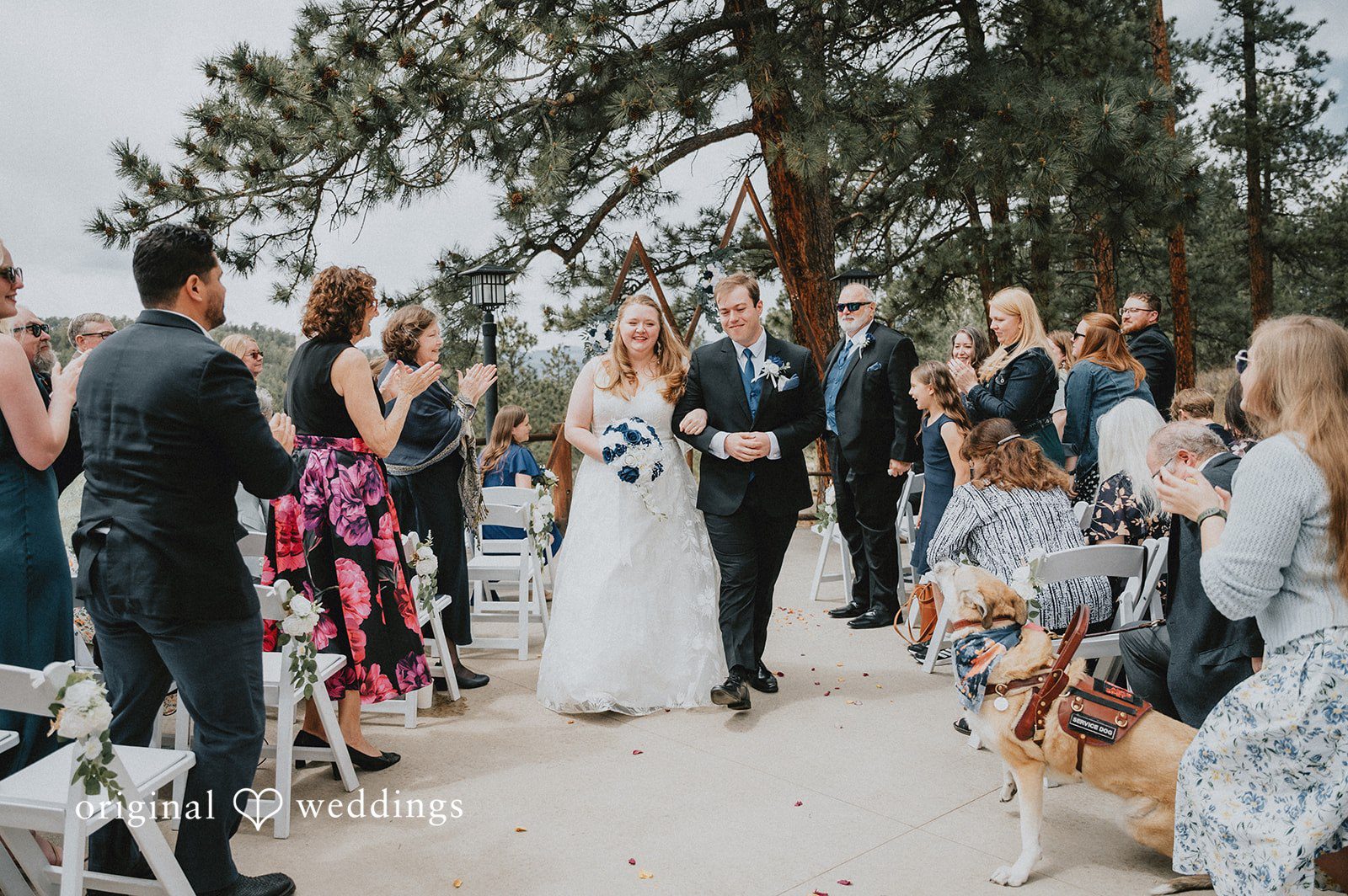 Kelsi + Christian Our Denver wedding photographers captured the moment the couple made a joyful exit