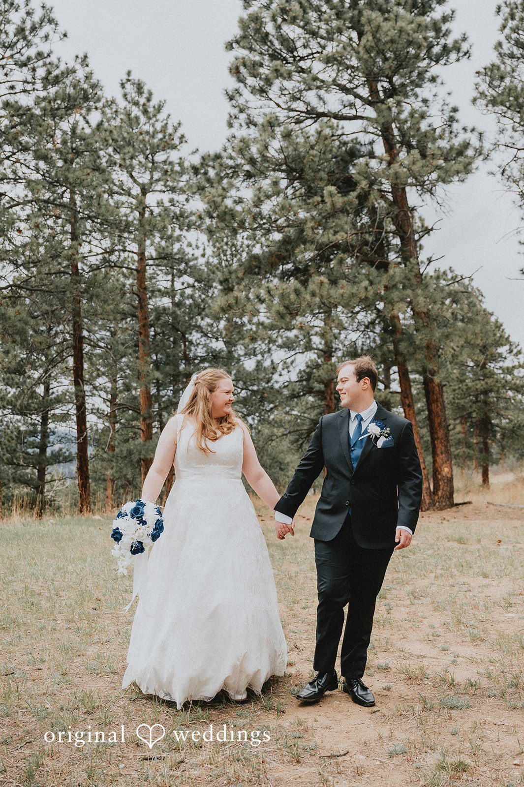 Kelsi + Christian The couple takes a walk through the field