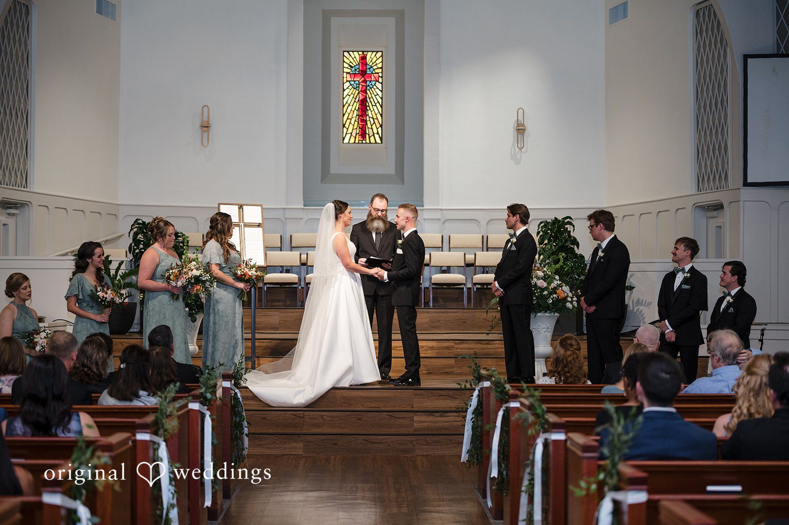 Bride and groom exchanging vows during wedding ceremony at Christ Covenant Sandy Springs
