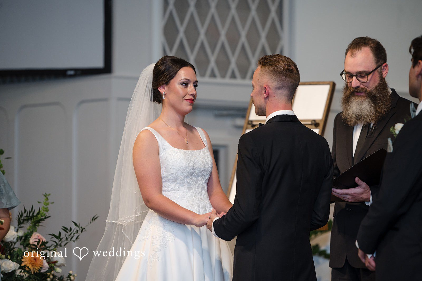 Bride and groom sharing an emotional moment during their wedding ceremony at Christ Covenant Sandy Springs photographed by Atlanta wedding photographers from Original Weddings