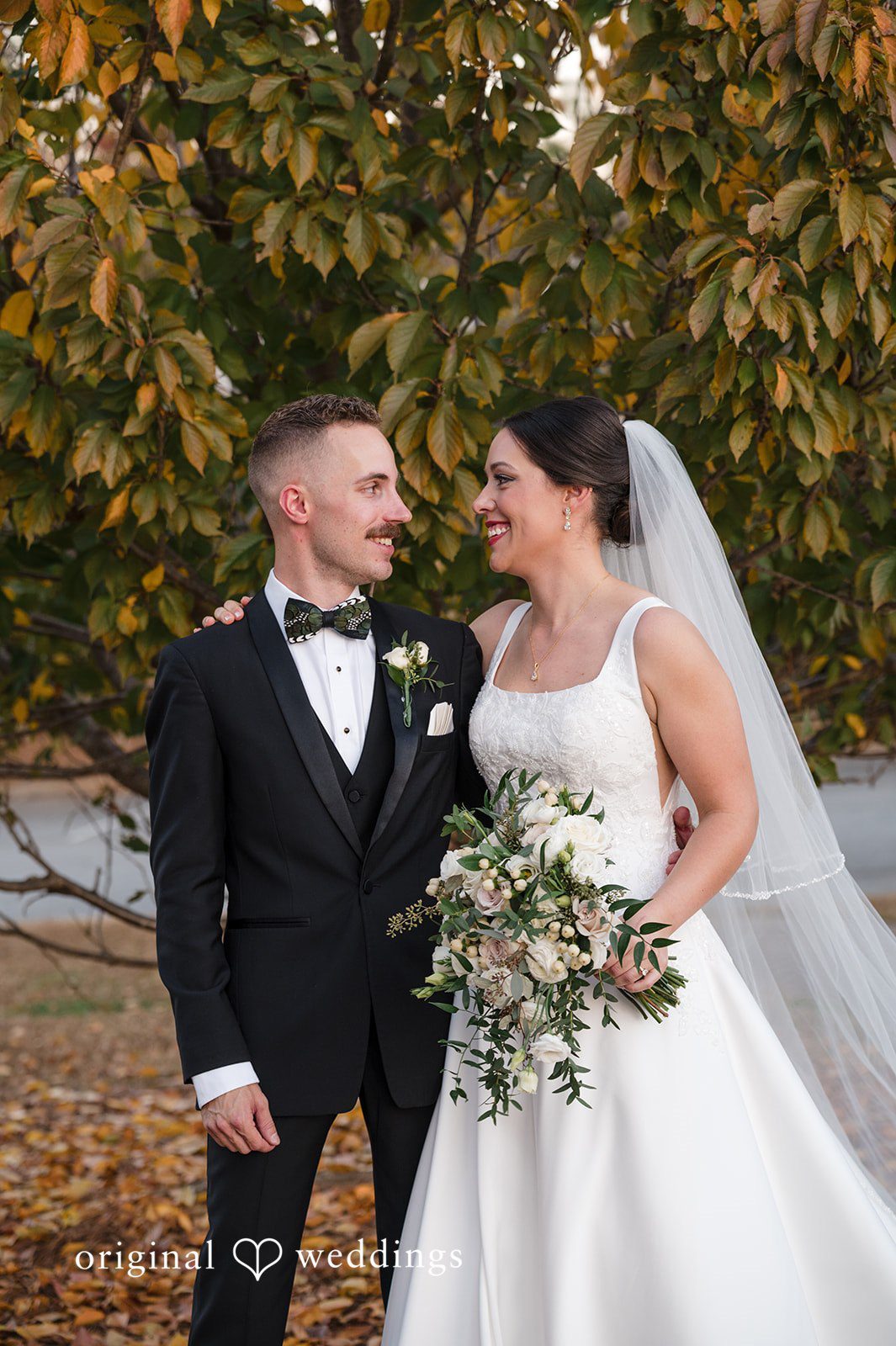 Bride and groom posing outdoors at Christ Covenant Sandy Springs photographed by Atlanta wedding photographers from Original Weddings