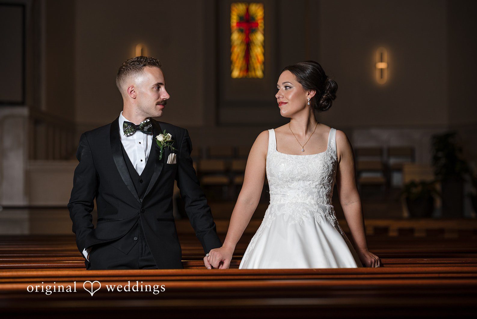 Bride and groom holding hands inside Christ Covenant Sandy Springs photographed by Atlanta wedding photographers from Original Weddings