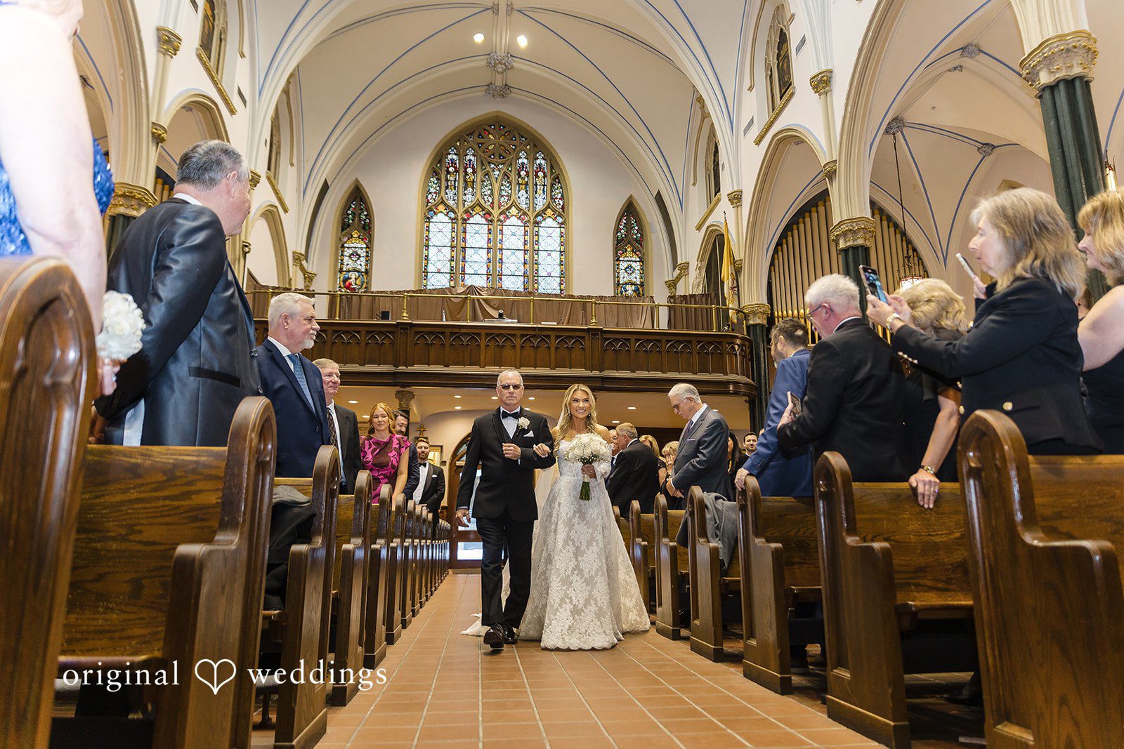 The bride's father walks bride down the aisle