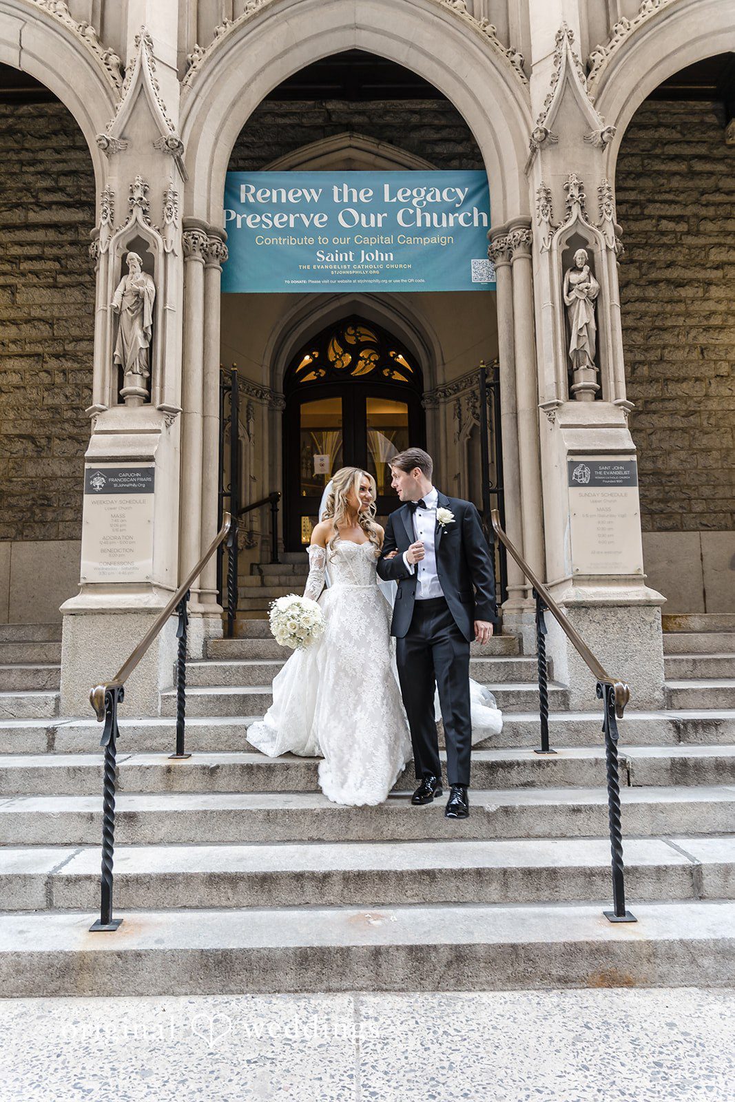 A stunning portrait of the couple in front of the church