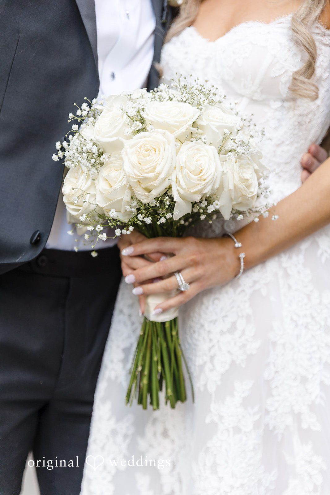 A close-up shot of the couple exposing the bride’s huge bouquet