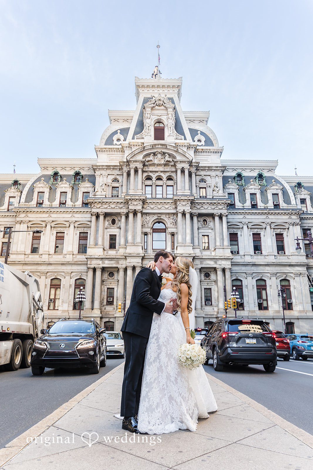 The couple shares a romantic kiss in the church grounds