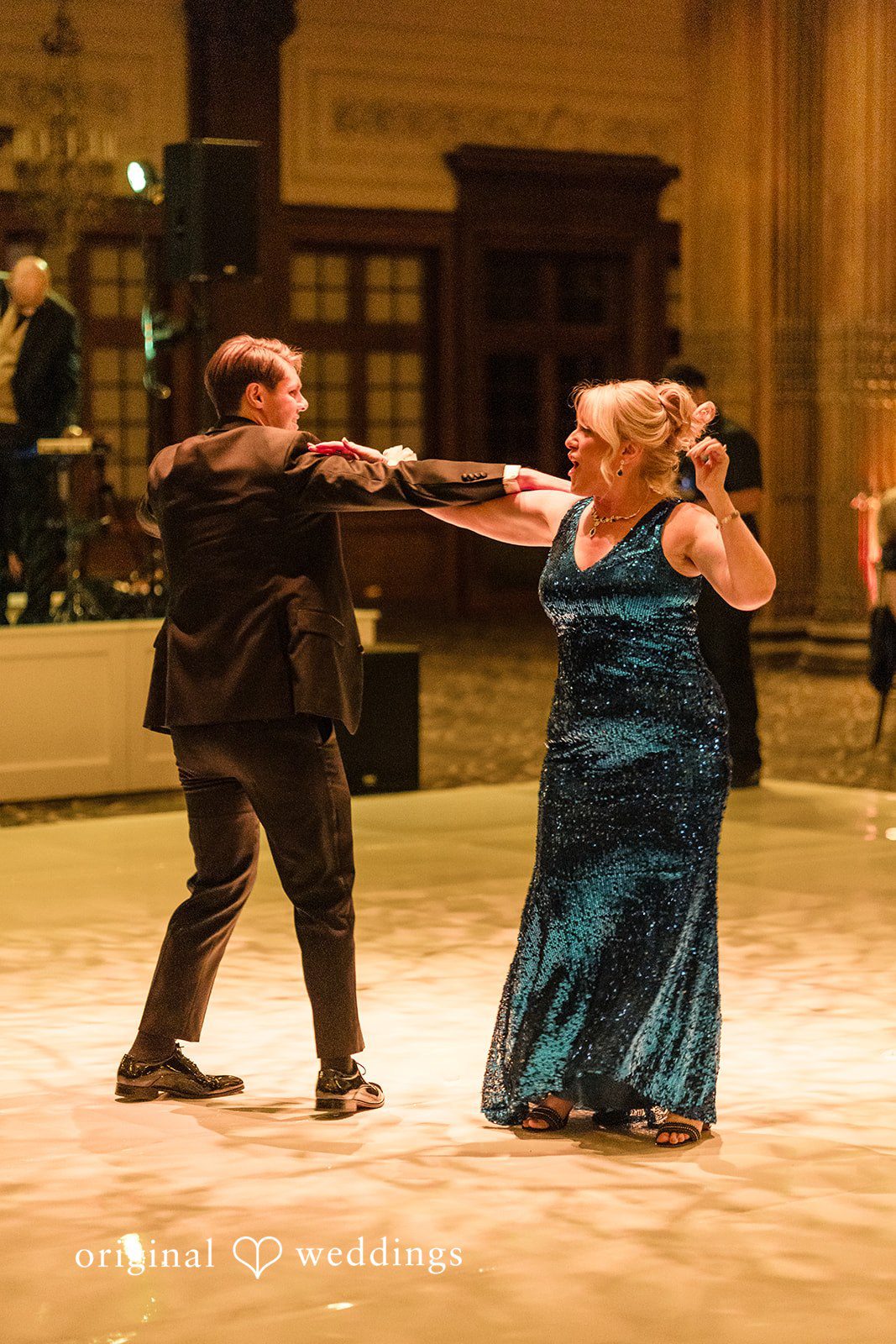 The groom dances with his mother