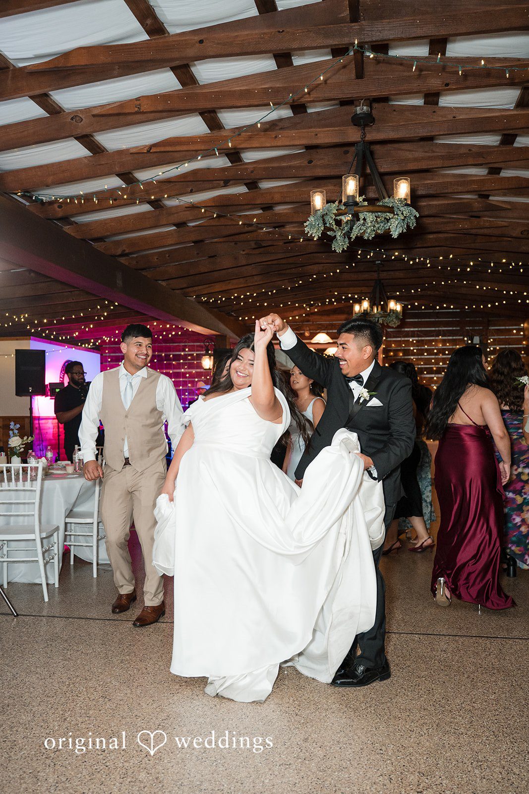Cecilia + Jose Bride and groom dancing together on reception