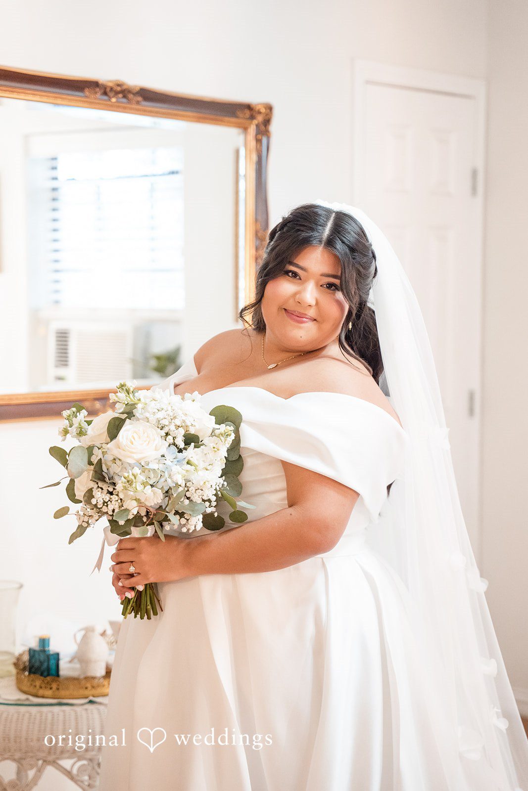 Cecilia + Jose Bride fully ready and posing beside mirror at Circle of Seven Ranch