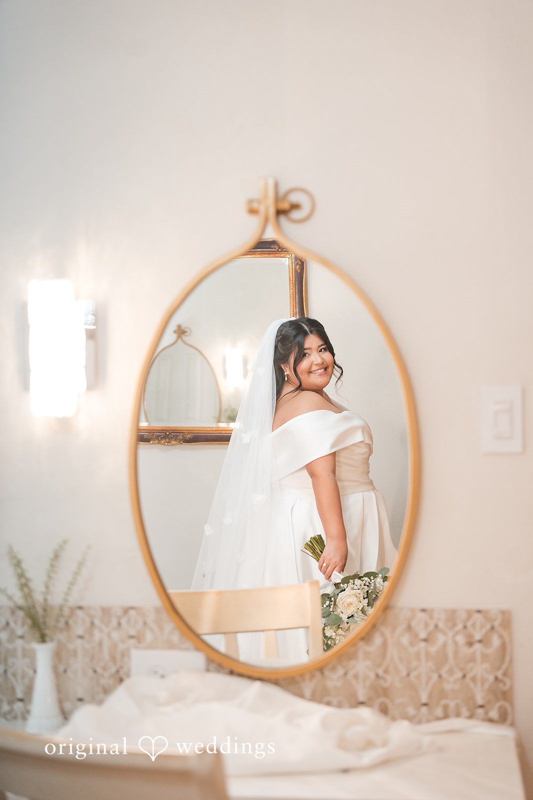 Cecilia + Jose Beautiful bride standing in front of mirror before ceremony