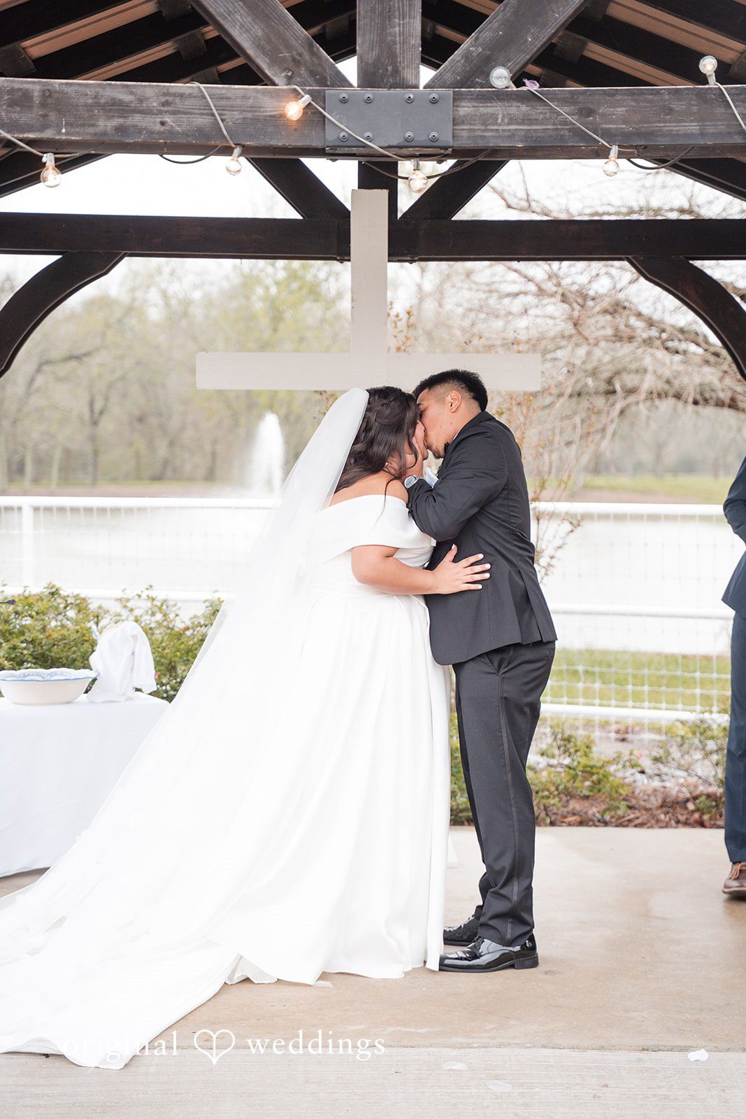 Cecilia + Jose Bride and groom sharing a romantic kiss on wedding day