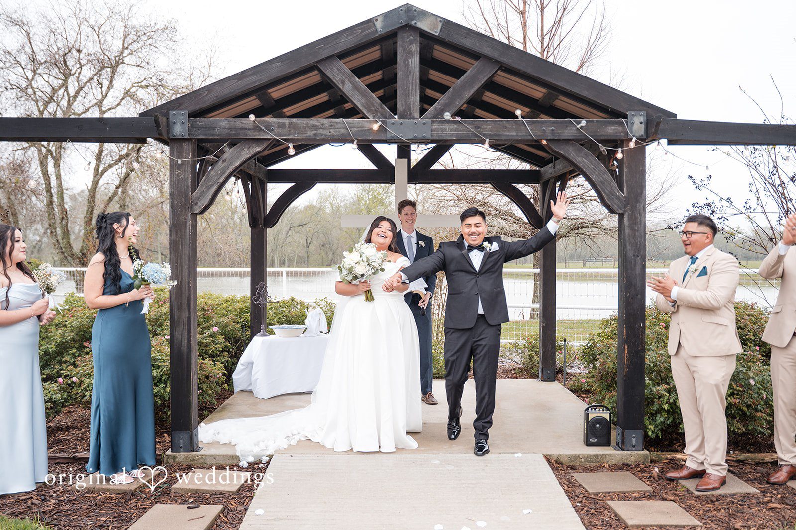 Cecilia + Jose Houston Wedding Photographers capturing couple standing and smiling at Circle of Seven Ranch by Original Weddings