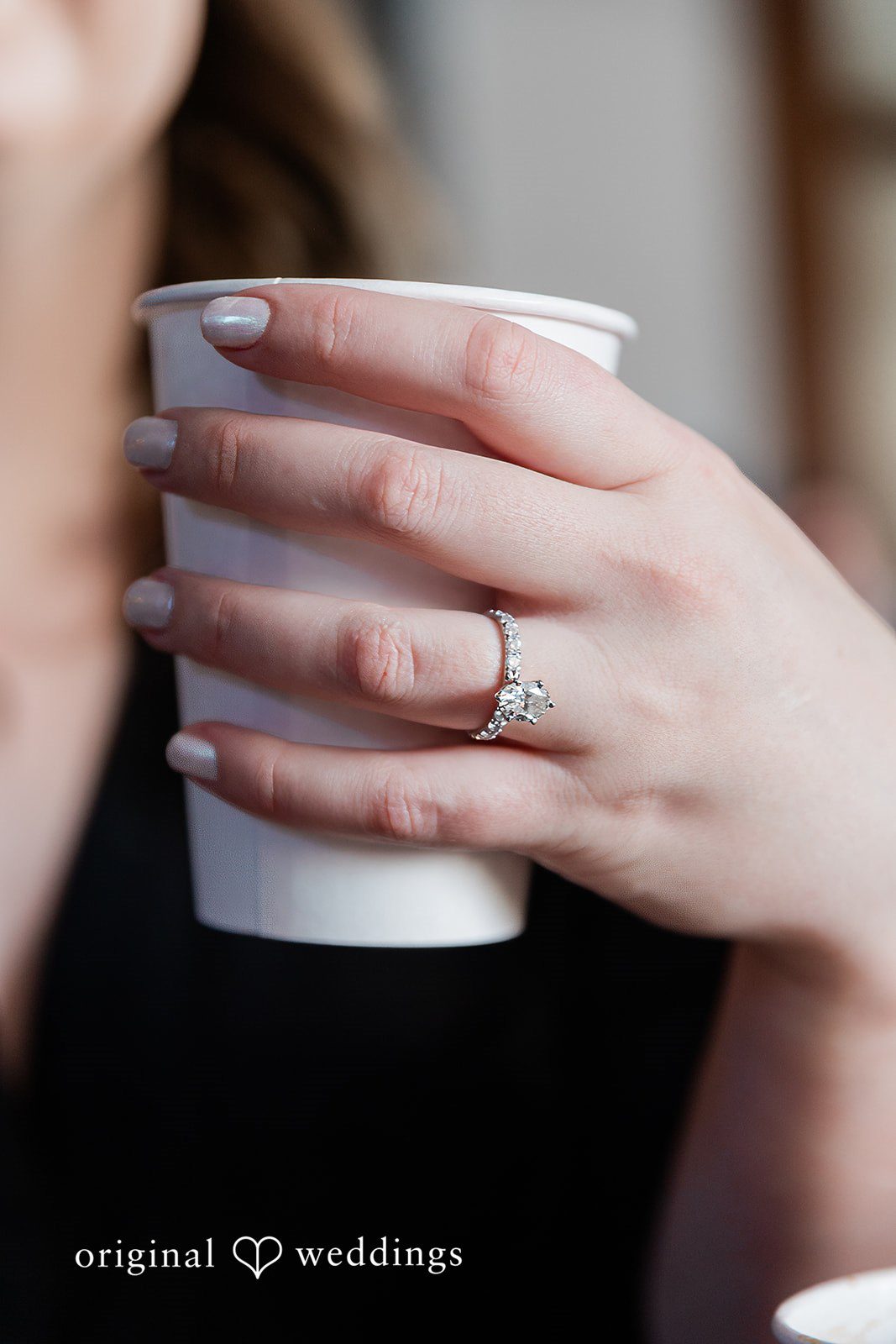 Engagement photography session at Coat Check Coffee by original weddings capturing the detailed picture of ring