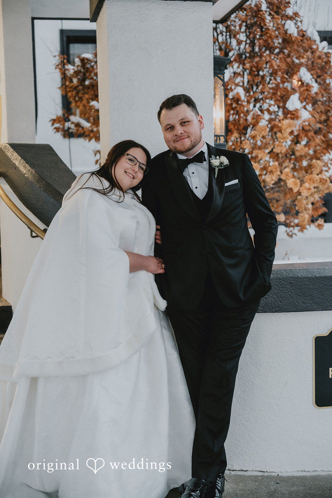 Bride and groom leaning toward each other during portraits