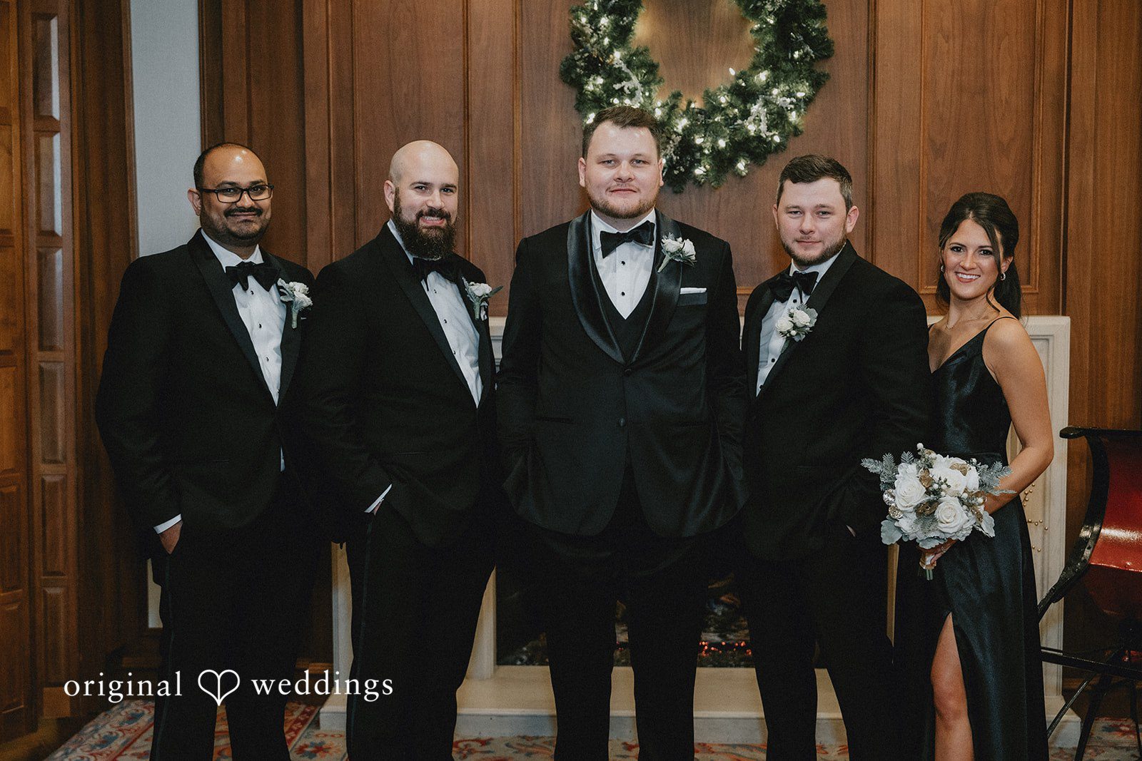 Groom posing with groomsmen after getting ready