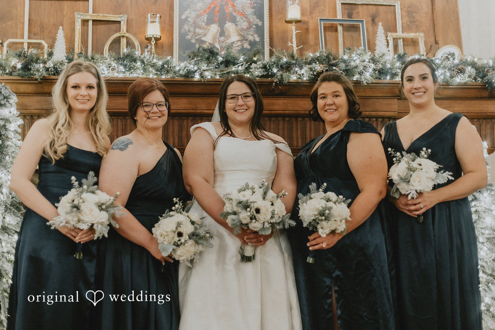 Bride posing with bridesmaids before the ceremony