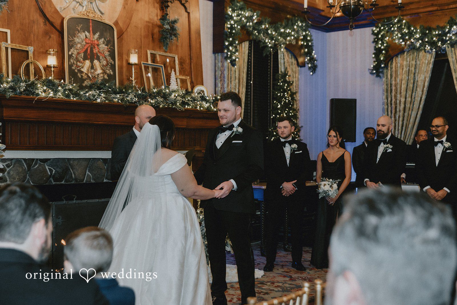 Bride facing away while listening to the groom during the vows