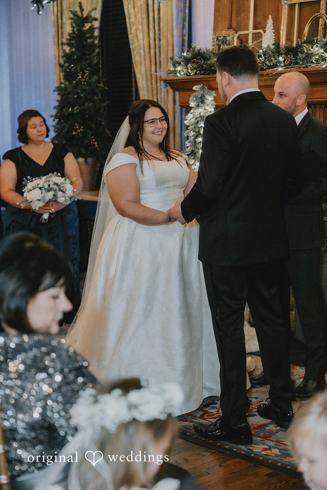 Groom facing away while listening to the bride during the vows