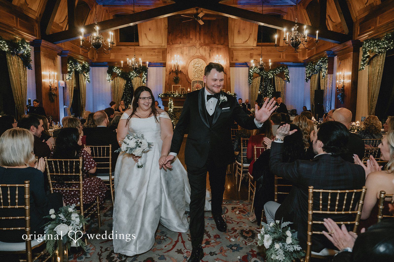 Bride and groom walking hand in hand after the ceremony