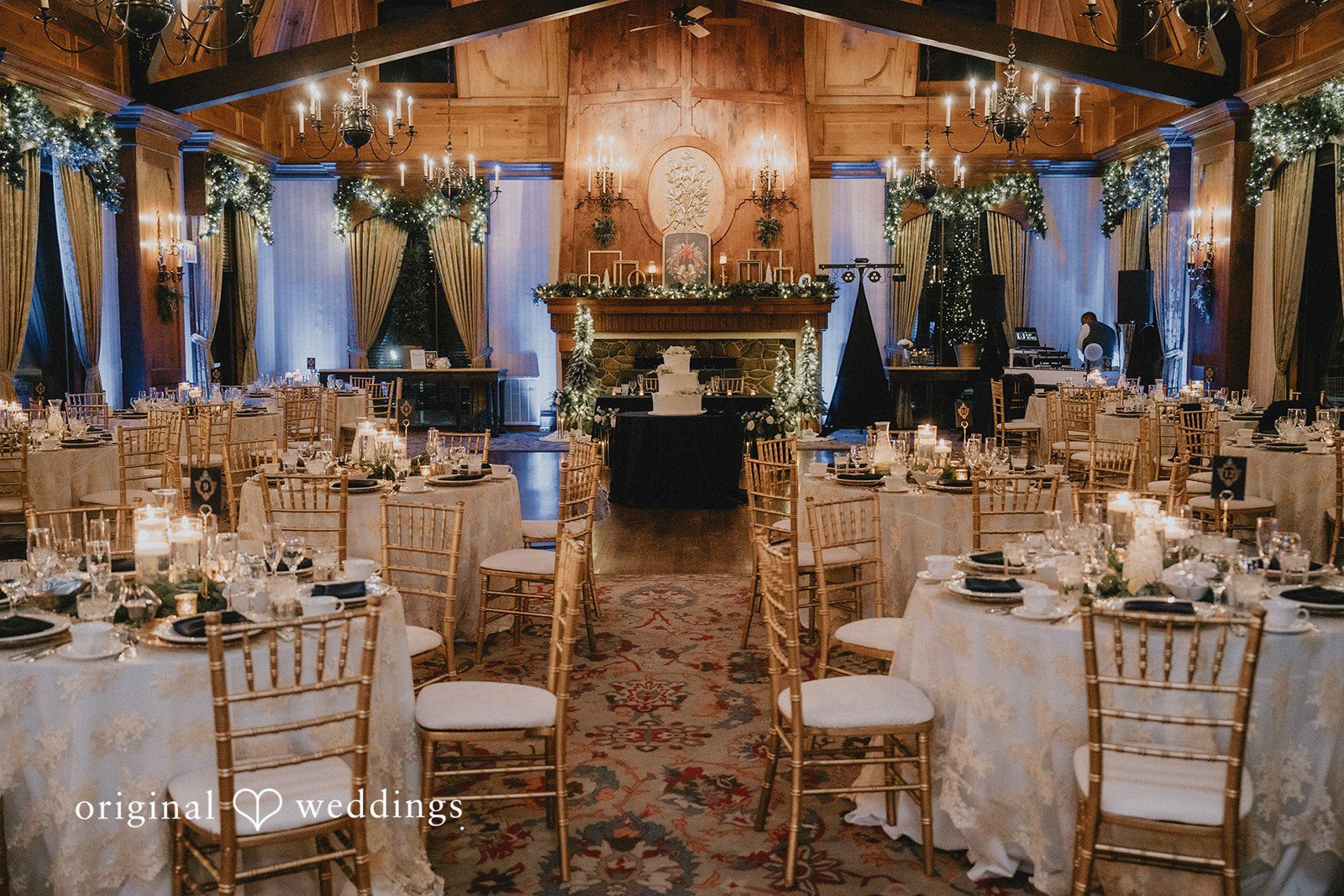 Wide view of decorated reception tables at the venue