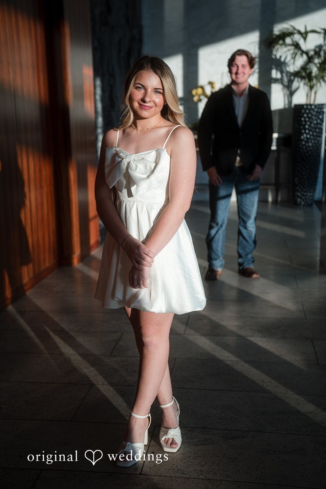 A man and a woman posing for engagement photography