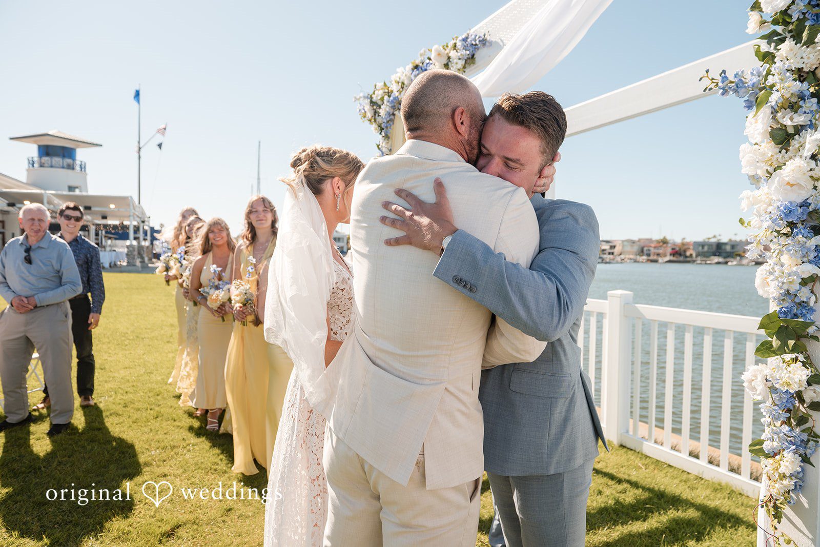 Emotional wedding ceremony hug at Colorado Cays Yacht Club