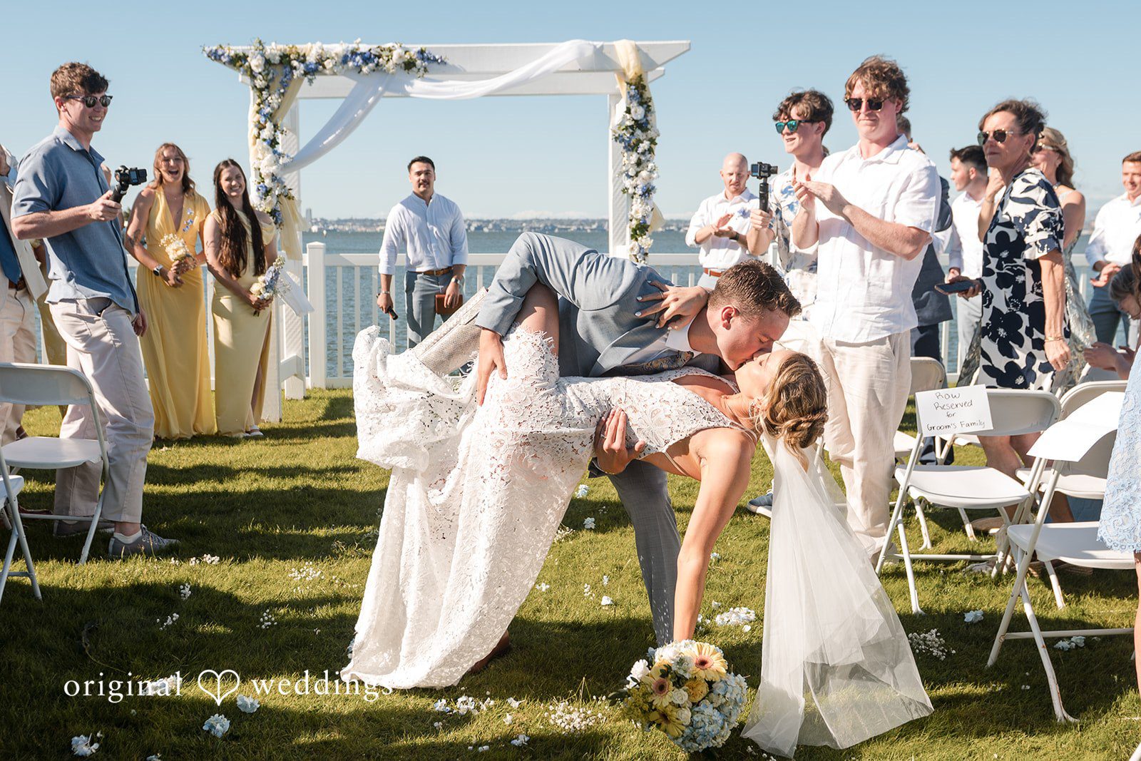Newlyweds sharing first kiss after ceremony