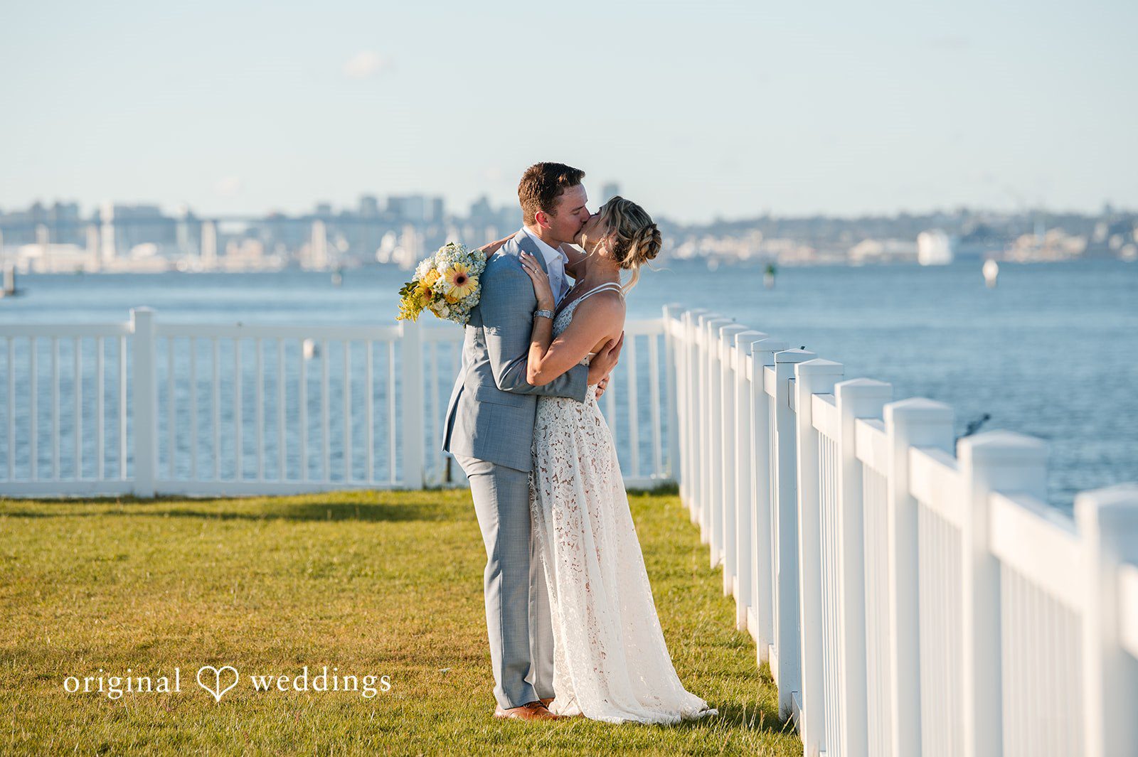 Romantic wedding kiss at Colorado Cays Yacht Club captured by San Diego Wedding photographers from Original Weddings