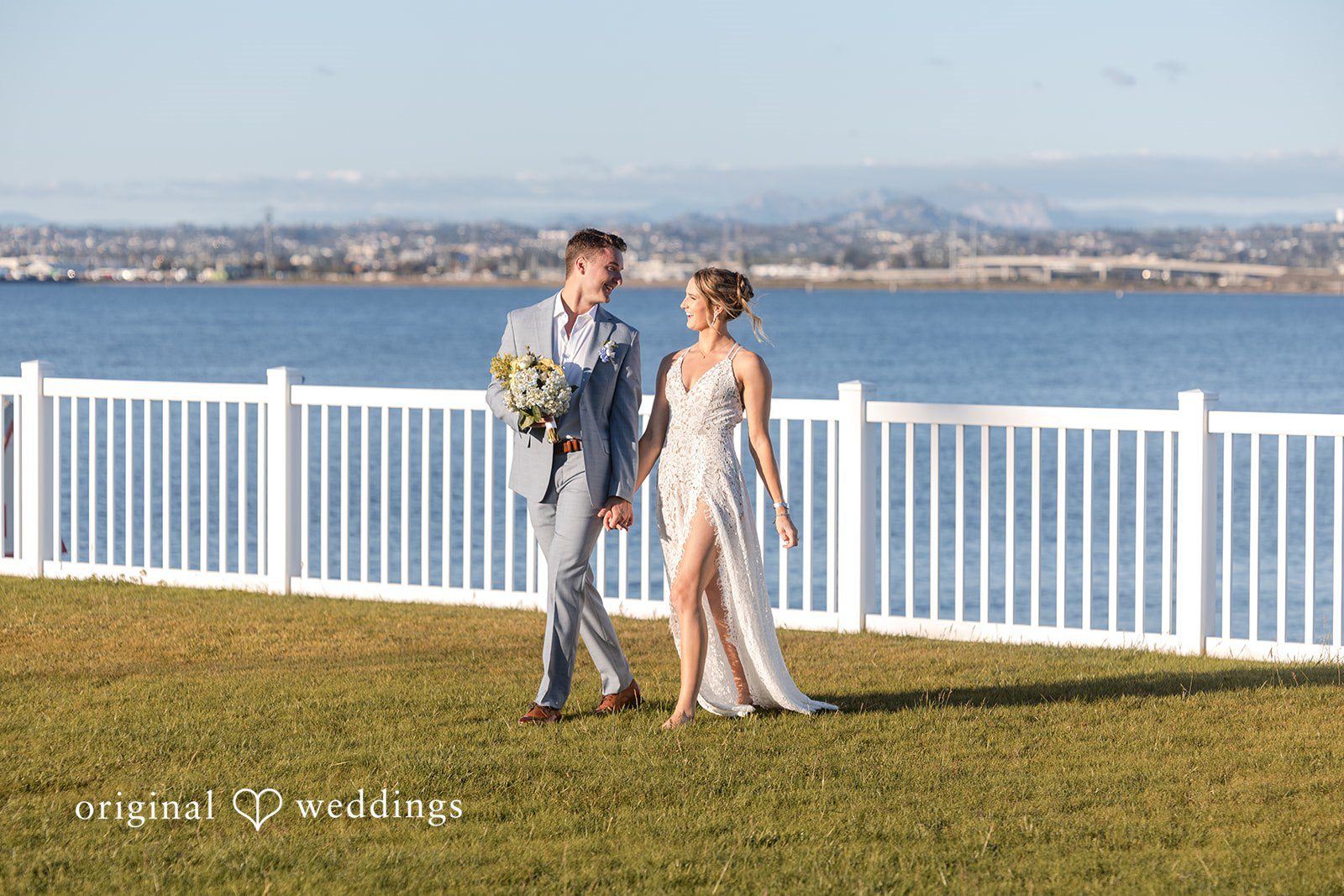 Bride and groom walking together at Colorado Cays Yacht Club captured by San Diego Wedding photographers from Original Weddings