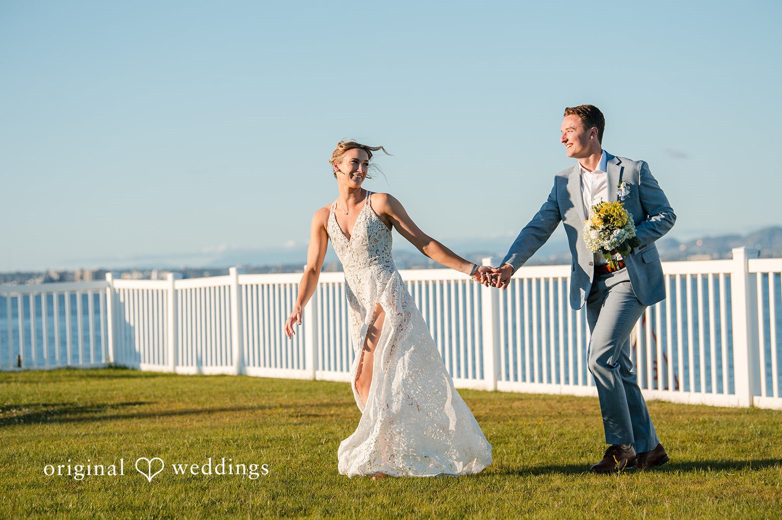 Elegant bride and groom picture near tropical garden scenery captured by San Diego Wedding photographers from Original Weddings