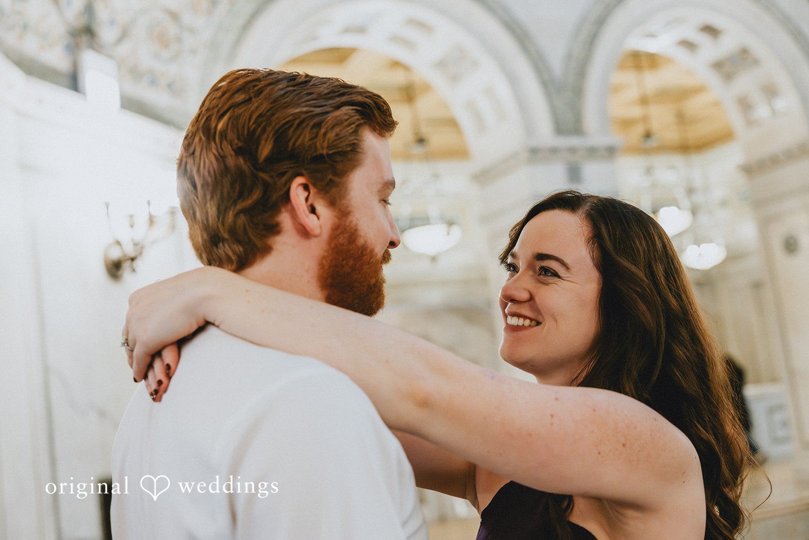 A candid hug moment of couple while looking at each other