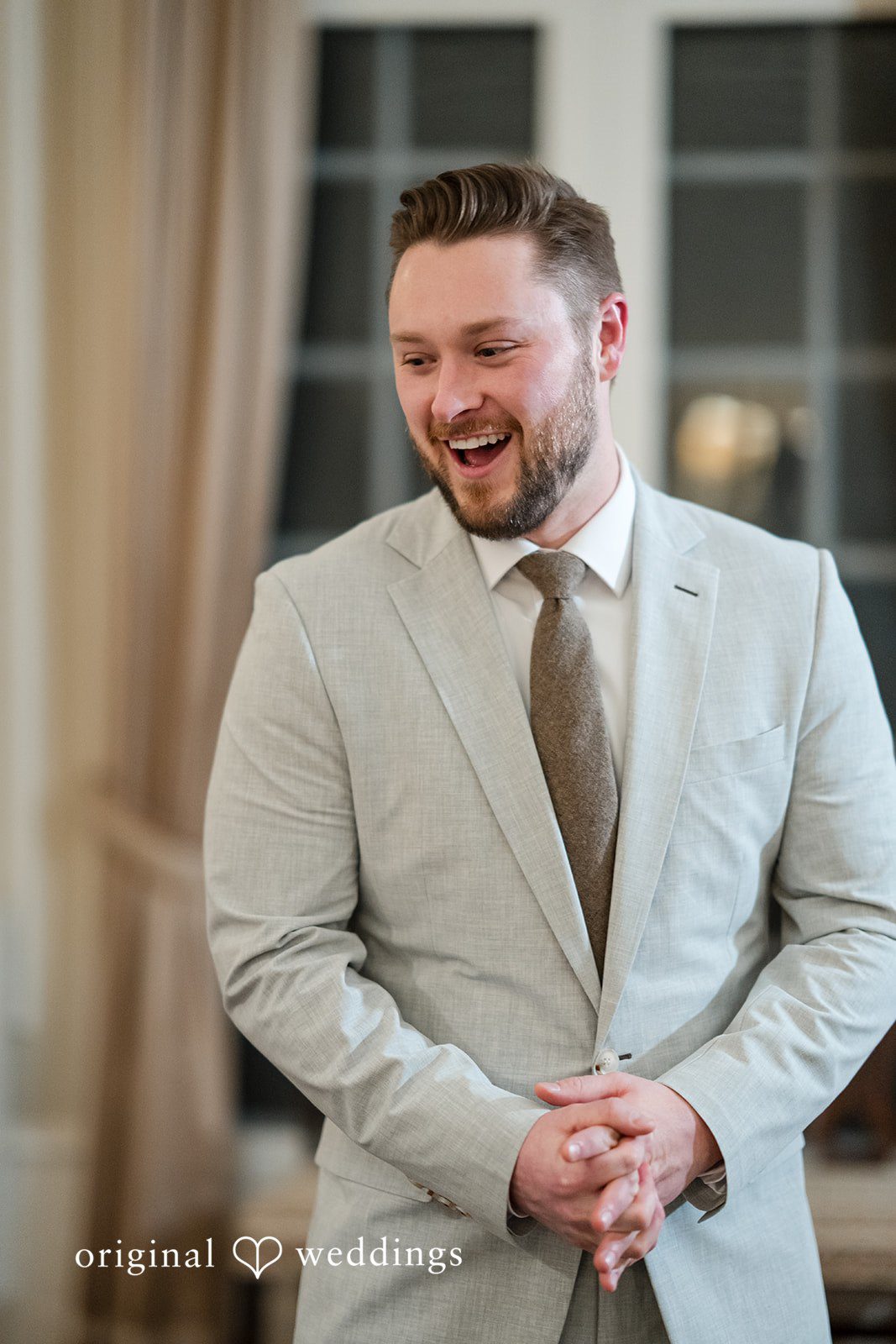 The groom shows excitement on seeing his bride